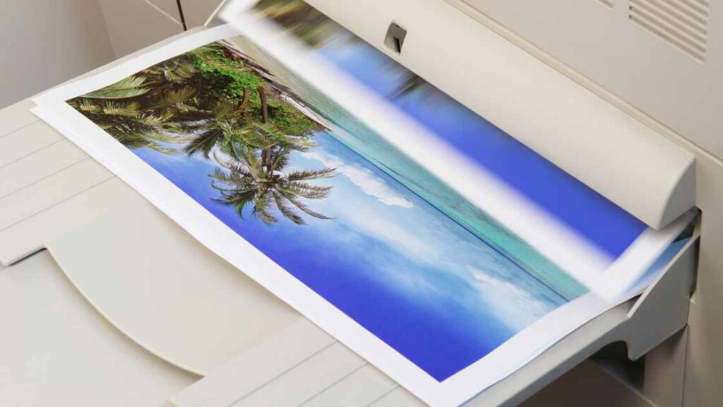 An island image print coming out of a printer representing the query: Do you mirror image for sublimation ?