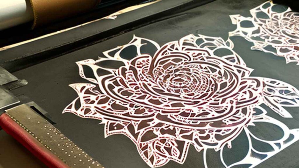 A leather piece With flowers design on screen printing screen representing the query : how to print on Leather with screen printing ? Or Is Screen printing on Leather possible?