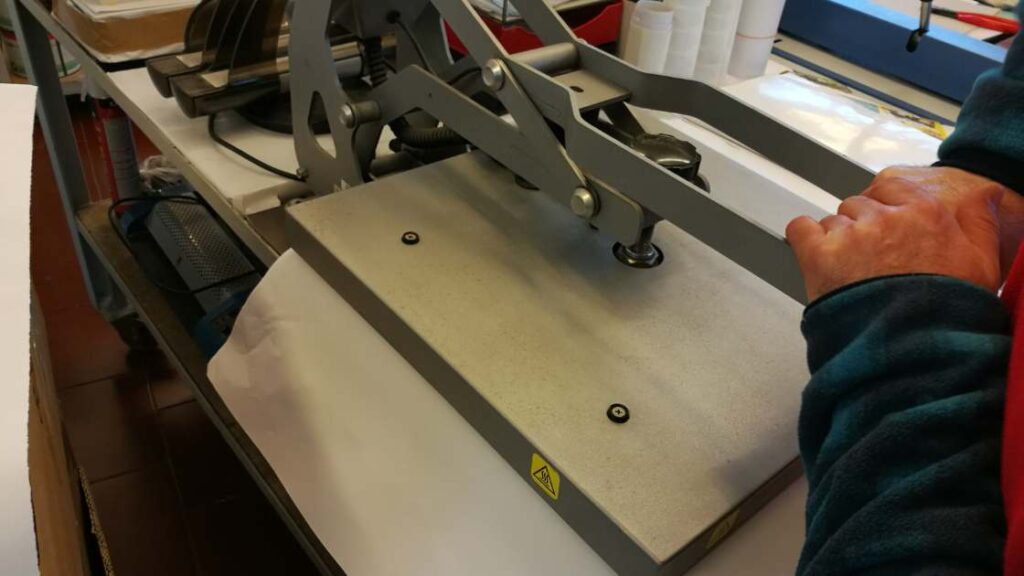 A heat press representing the query: Why is my sublimation not transferring due to improper pressure ?