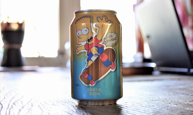 A simpsons exotic soda aluminum can on the floor. Representing the query : Sublimation on aluminum or sublimate on aluminum and Is dye sublimation on aluminum possible ?