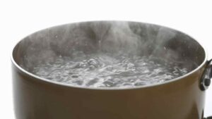 A pot of boiling hot water representing the query: How to soften stiff thick jeans?