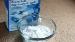 a bowl of baking soda representing the query: How to soften stiff thick jeans with baking soda?