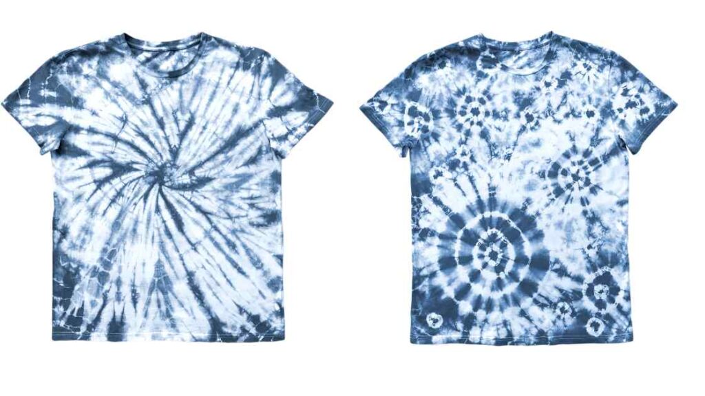 Two tie dyed grey shirts with blue color representing the query: Can you tie dye a grey Shirt? Or Can you tie dye a gray shirt ? Or how to tie dye a grey shirt ? Or Is tie dyeing grey shirt possible ? Or How to tie dye grey shirt ? Or Is tie dying a grey shirt possible ?