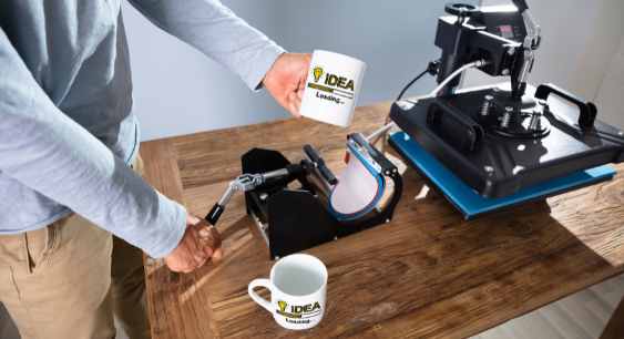 A person printing designs on mugs with mug press representing the queries: How to print sublimation images ? Or How to print sublimation images for tumblers ? Or How to print sublimation images for mugs ? Or How to print sublimation images for shirts? Or How to design sublimation images ? 